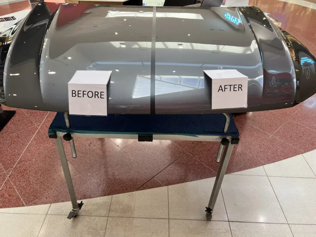 A car bonnet on a stand: the left half, labelled BEFORE, shows dents; the right half, labelled AFTER, has been repaired